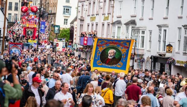 The Northern Echo: Crowds follow the banner parade on New Elvet, Durham, at the last Big Meeting staged, in 2019 Picture: DMA 